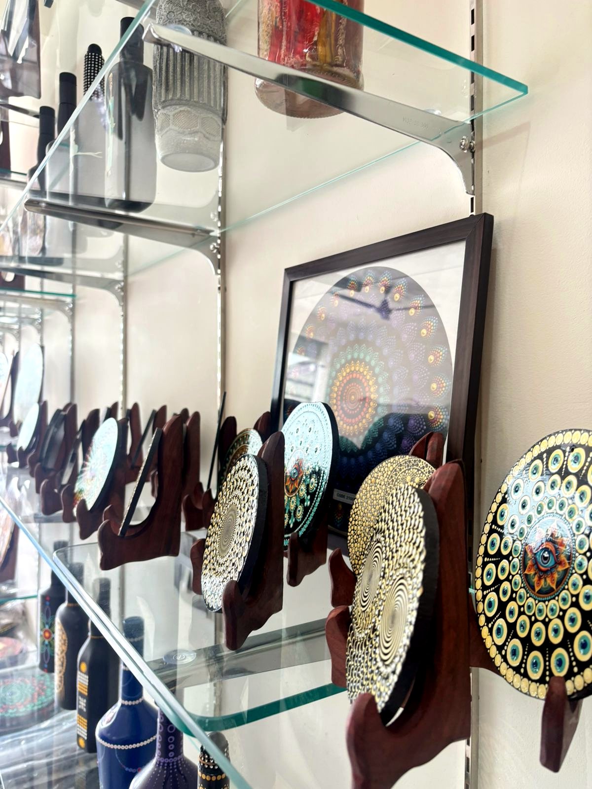Side view of shelves with decorative artwork plates