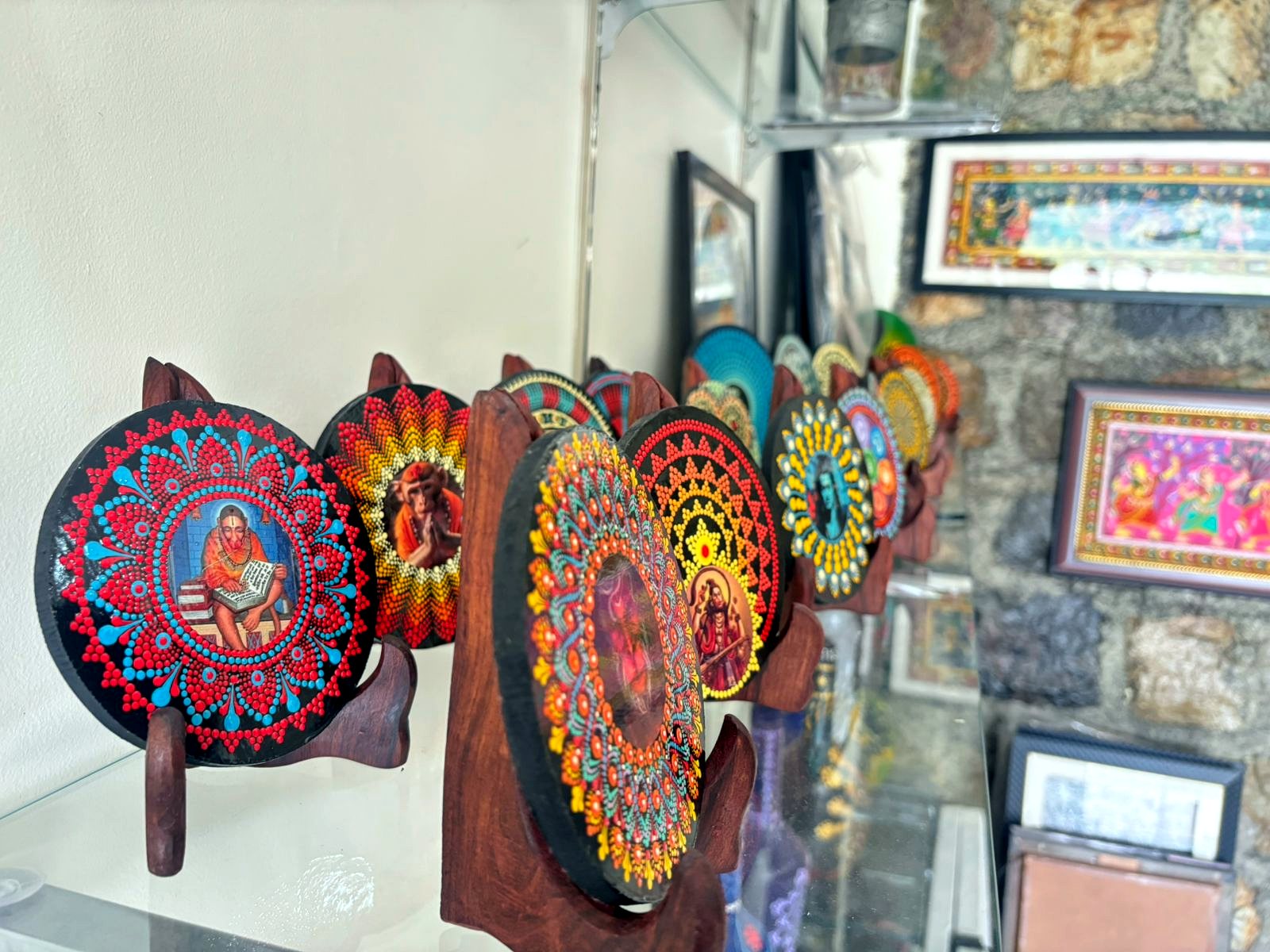 Colourful dot mandala artworks on display